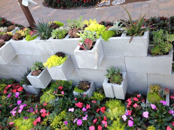2. Use Cinder Blocks To Plant Flowers Inside You can create a whole garden  wall using cinder blocks. Arrange …