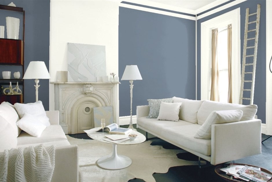 A stylish living room with Bachelor Blue walls and elegant white furniture