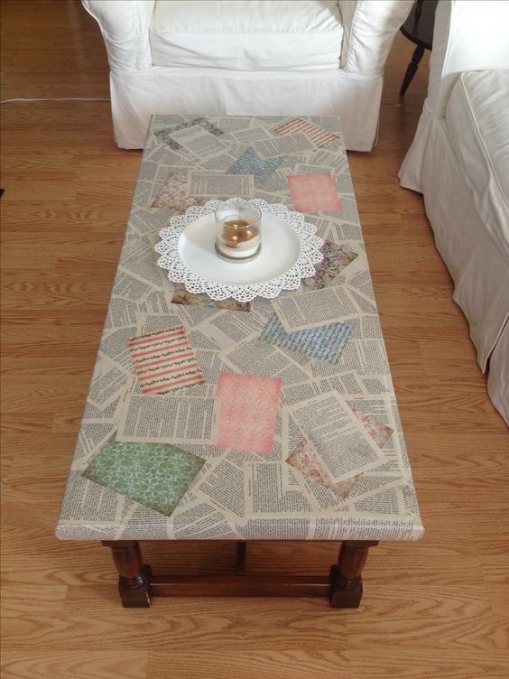 A decoupage coffee table crafted from newspaper, showcasing a unique and artistic makeover