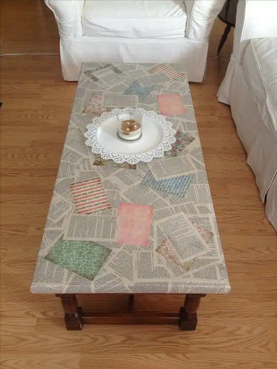 A decoupage coffee table crafted from newspaper, showcasing a unique and artistic makeover