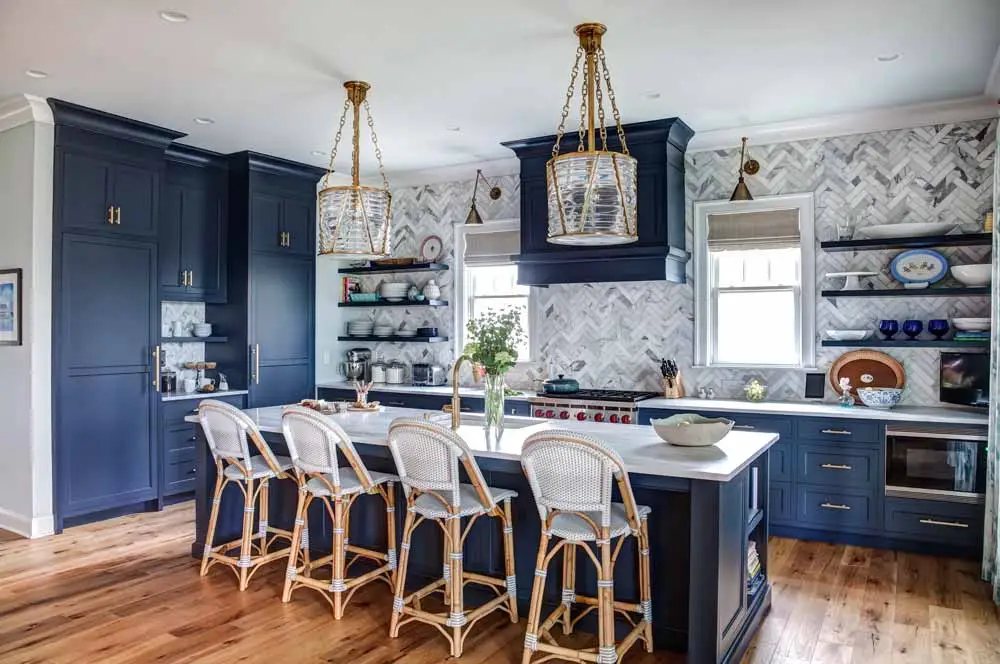  A kitchen with Hale Navy blue cabinets and white counter tops