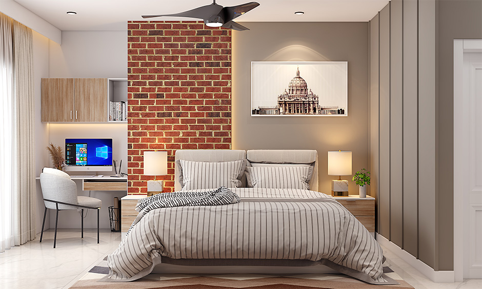 A cozy bedroom with a brick wall and a bed