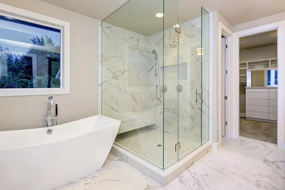 https://posh.co.uk/wp/wp-content/uploads/2023/03/homeguide-marble-walk-in-shower-with-dual-shower-heads.jpg