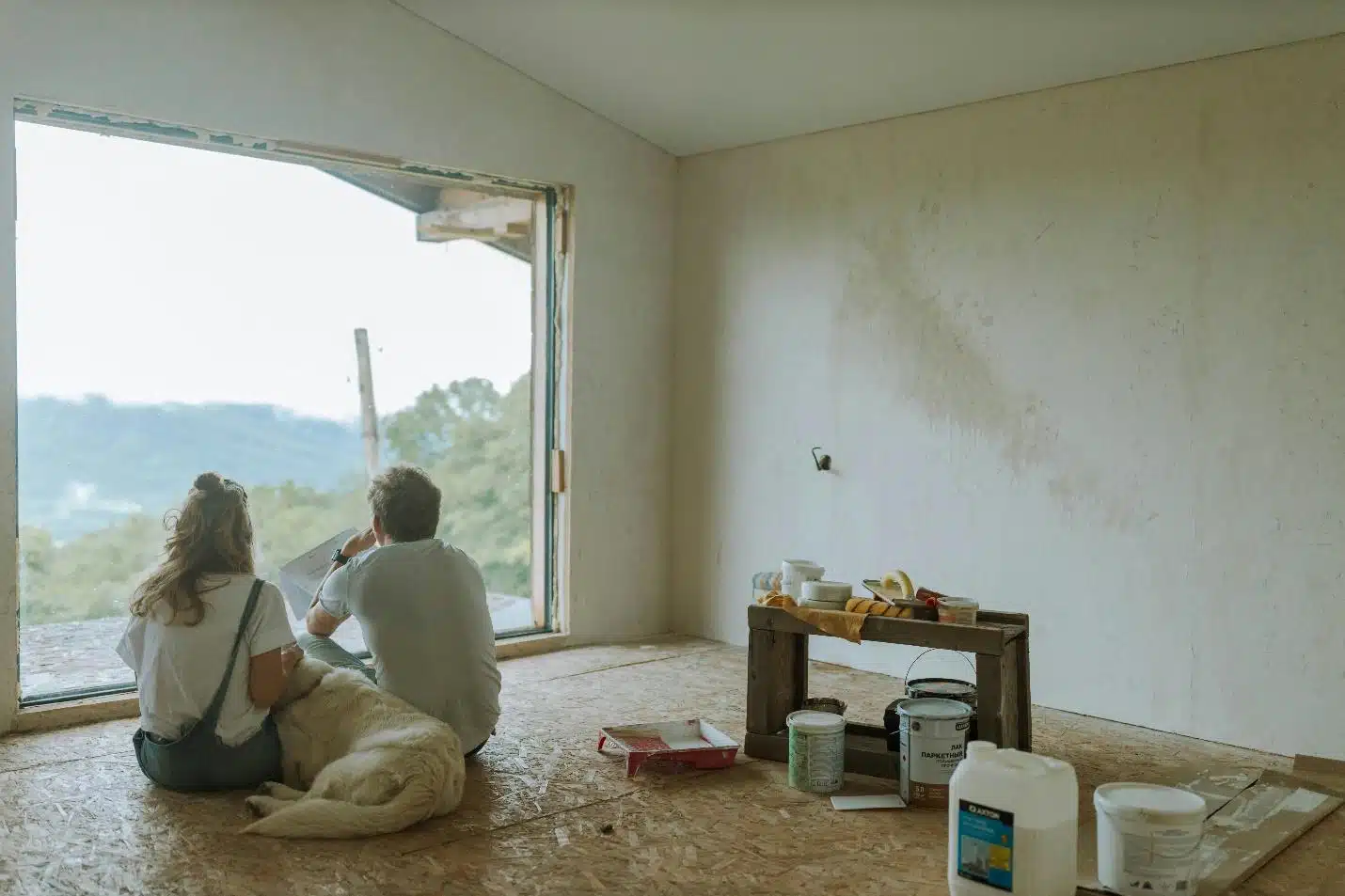 A couple of people sitting on the floor in a room with a large window AI-generated content may be incorrect.