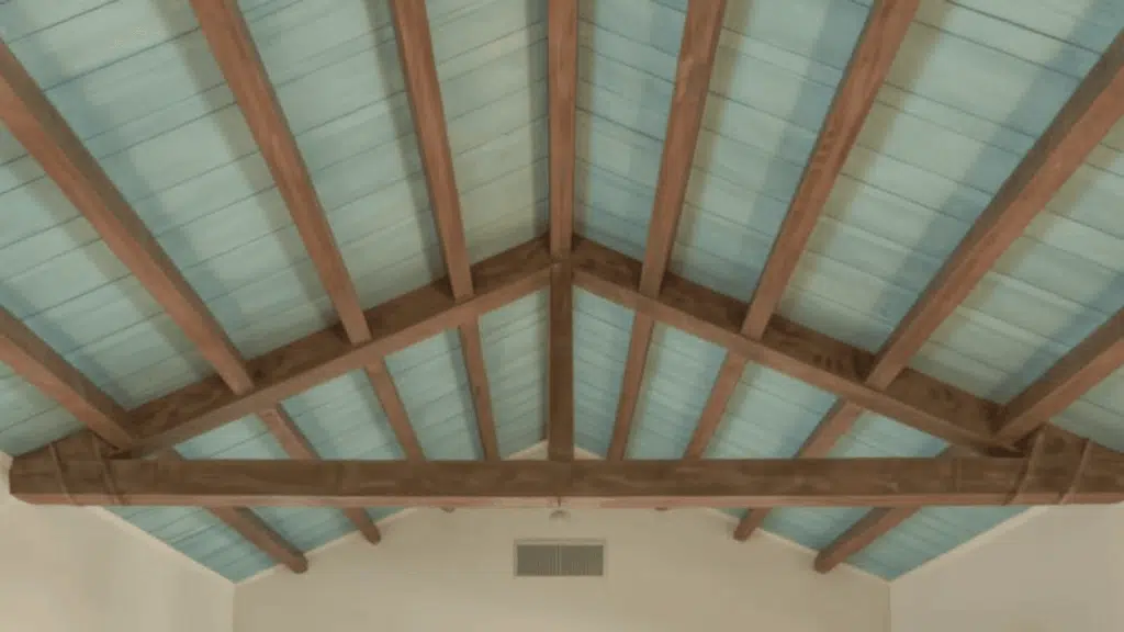 painted beams in a contrasting color vaulted ceiling