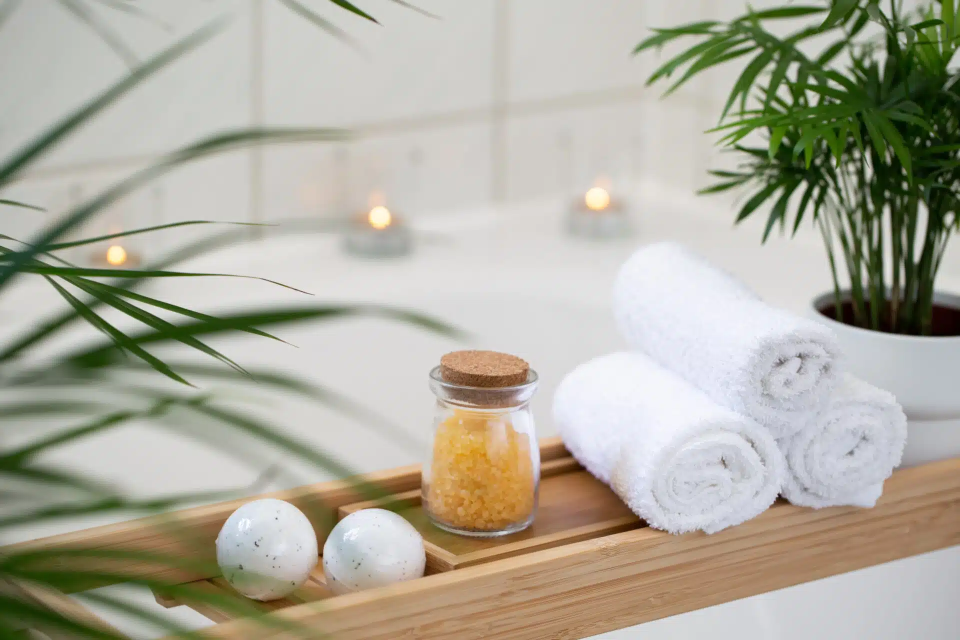 Bathroom with candles and tropical plants