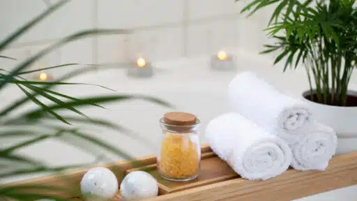 Bathroom with candles and tropical plants