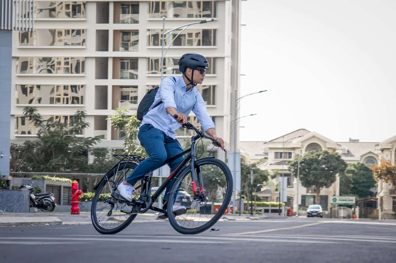 a young man riding his bike in a city