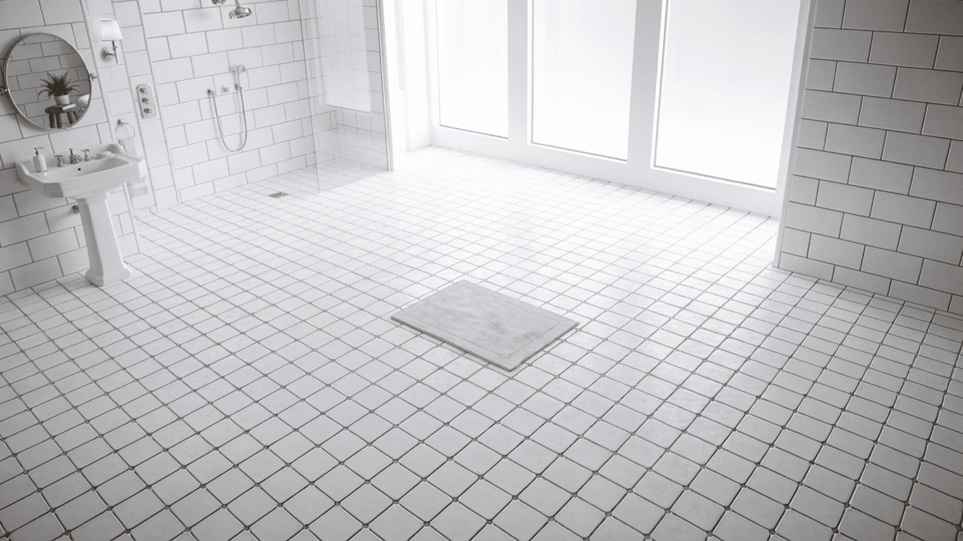 A bright white bathroom with a pedestal washbasin, clean square floor tiles and clearly visible grout lines on both floor and wall surfaces