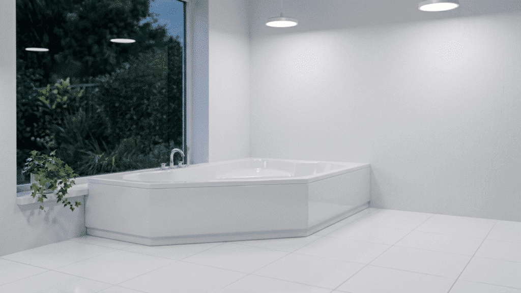 a corner garden tub fitted snugly between two walls in a well-lit bathroom leaving the remaining floor area open and accessible