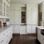 a sleek white coloured modern gallery kitchen design
