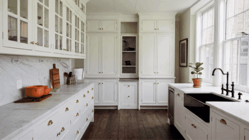 a sleek white coloured modern gallery kitchen design