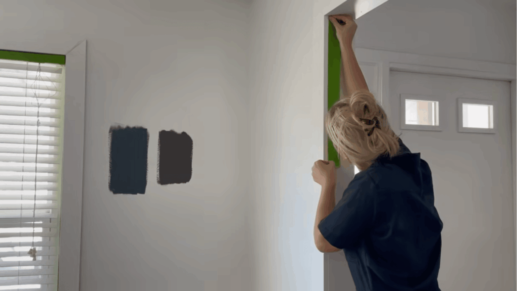 applying painters tape along trims and edges for clean lines
