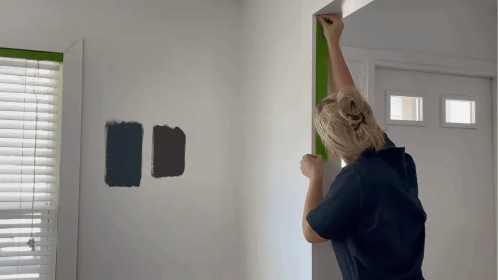 applying painters tape along trims and edges for clean lines