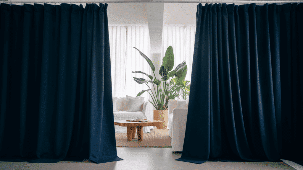 blackout curtains blocking out light in a bedroom for better sleep.