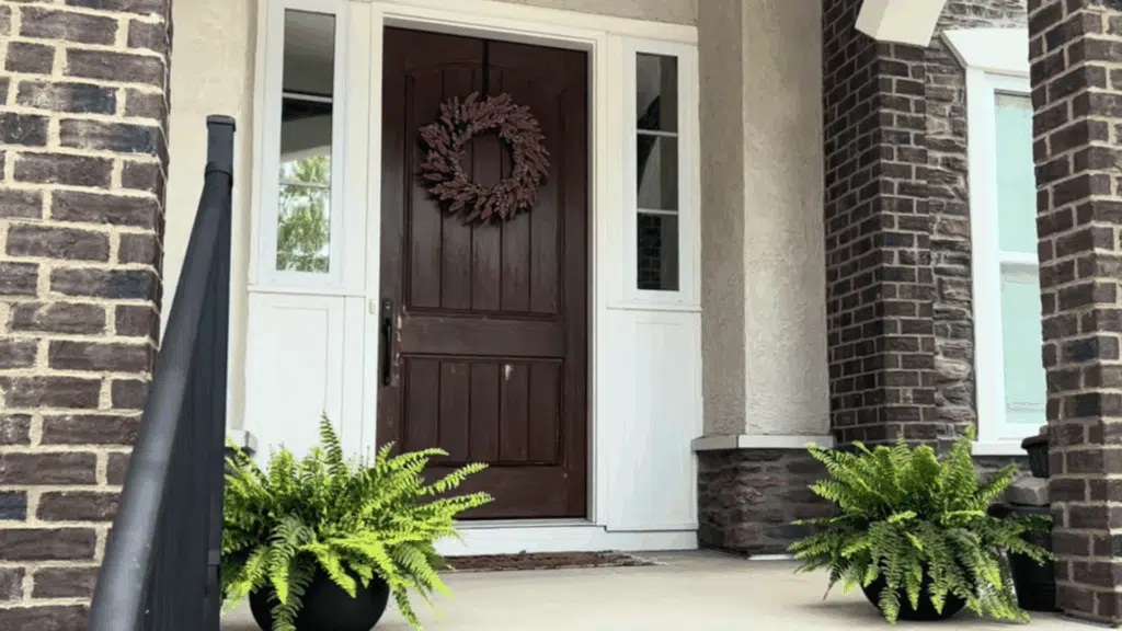 brown door, bare, with holes from the removed door handle and key lock