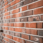 close-up of clean, natural red brick with detailed mortar lines and no paint