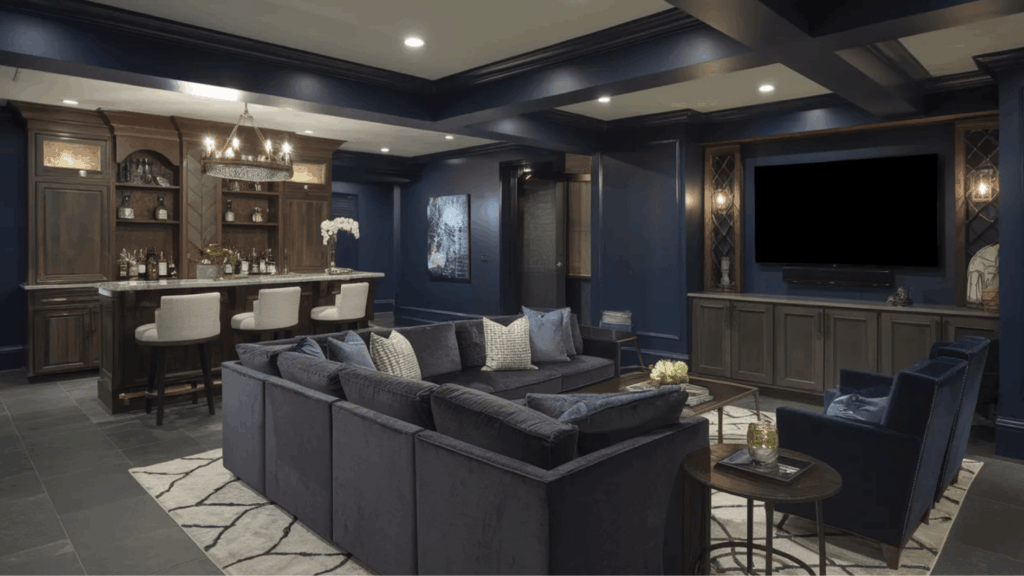 dark navy basement walls with matching trim and ceiling beams, bold contrast, moody lighting, and modern lounge setup