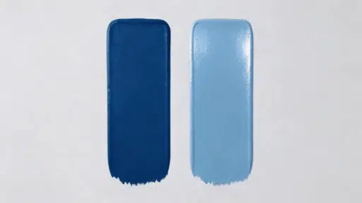 flat vs eggshell paint swatches showing matte dark blue and soft sheen light blue finishes on a wall surface