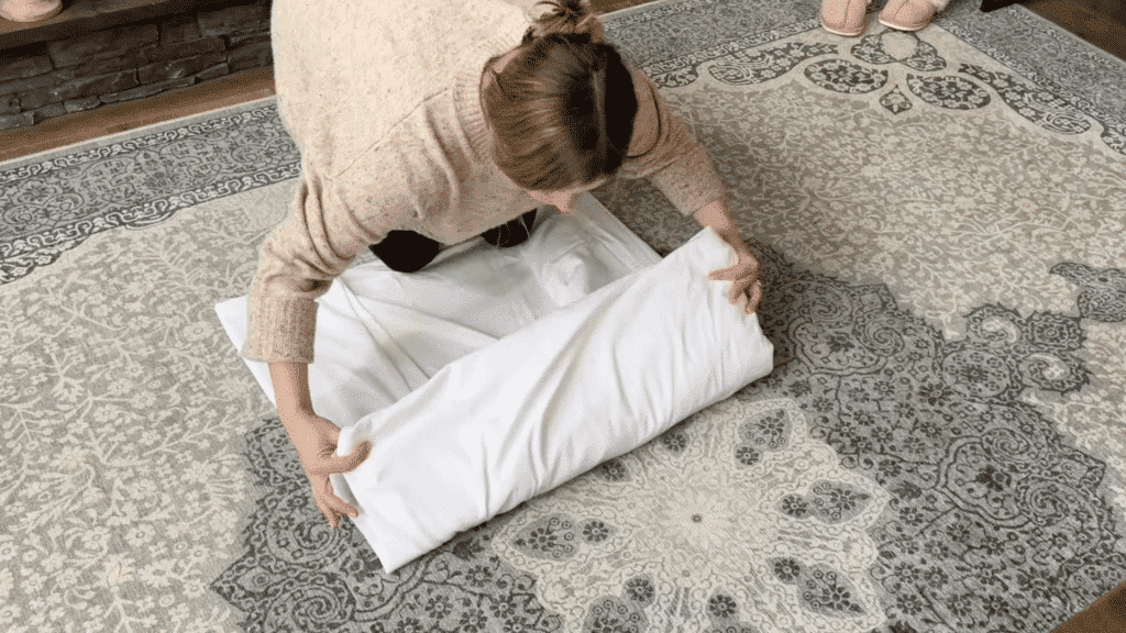 folding sheet into thirds and then into a compact square for easy storage