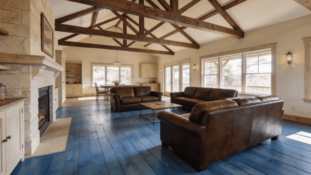 high ceiling farmhouse living room with blue-stained wood flooring