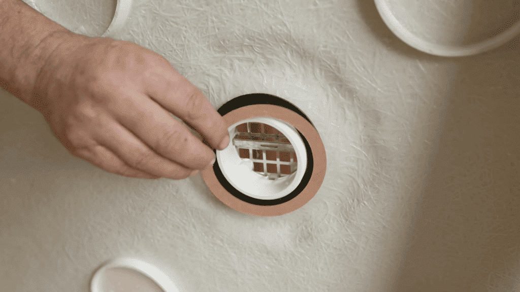 installing the drain flange into the pan’s drain opening