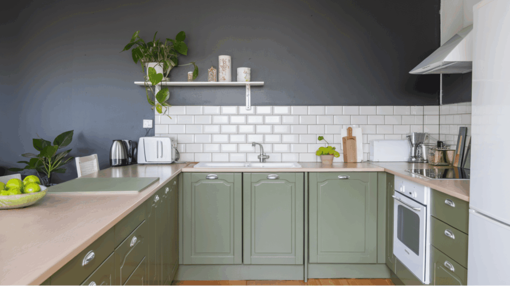 kitchen with olive cabinets, gray walls, white subway tile backsplash, and wood counters.