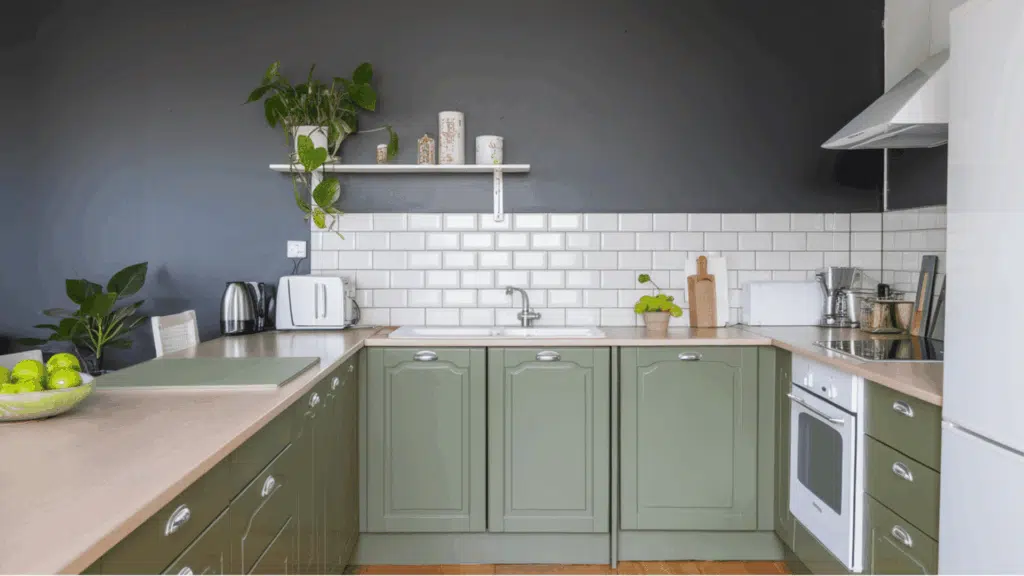 kitchen with olive cabinets, gray walls, white subway tile backsplash, and wood counters.