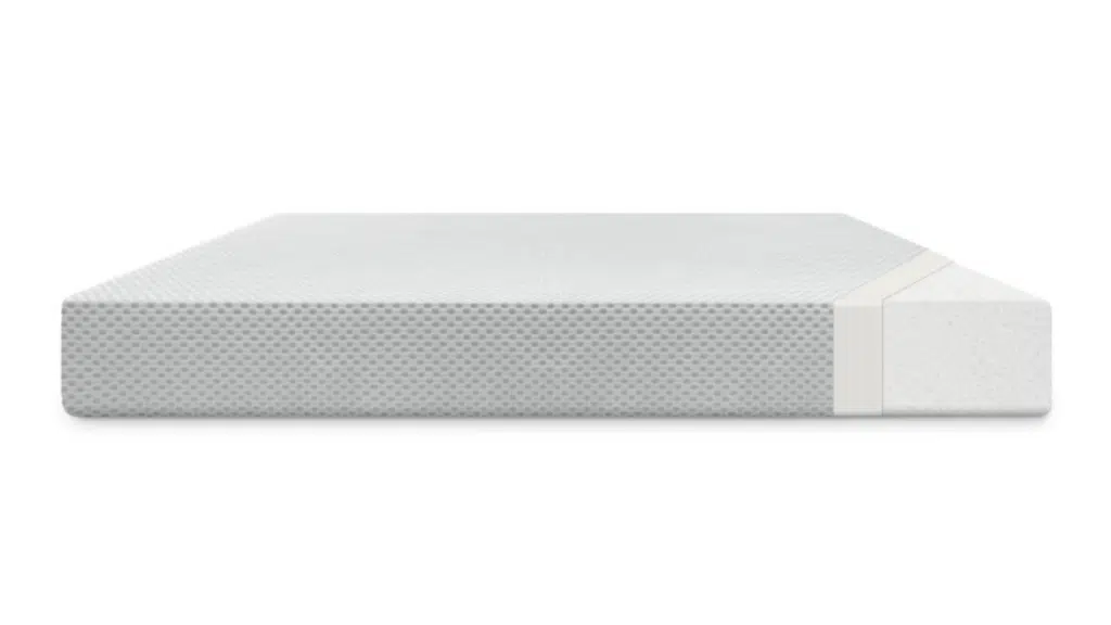 low-profile gray foam mattress with textured cover and cutaway side showing inner layer
