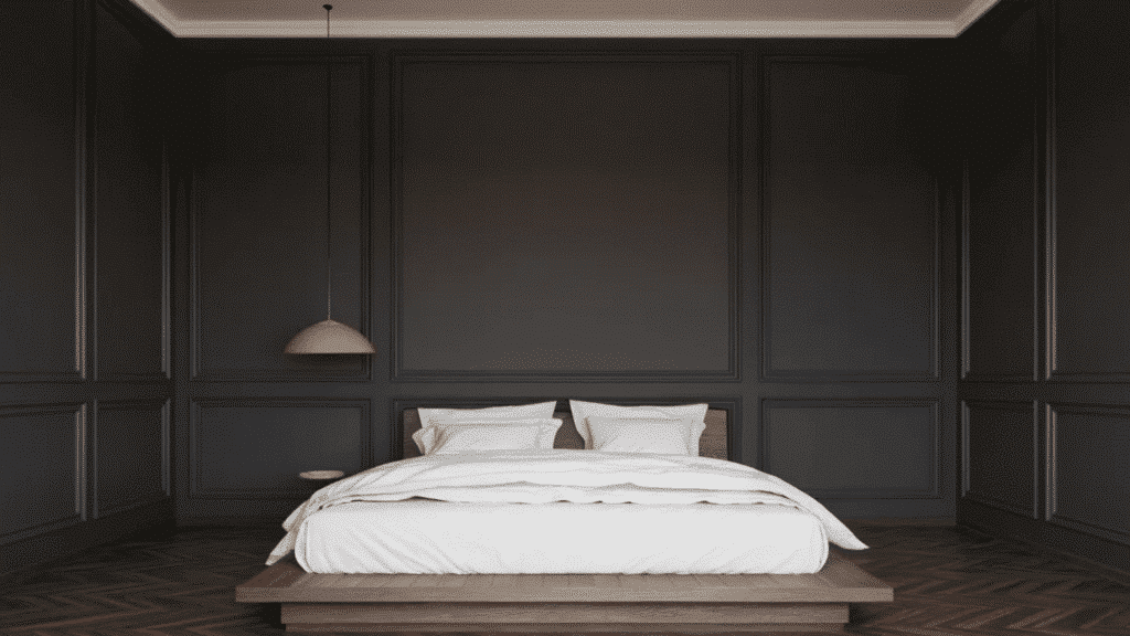 modern bedroom with dark paneled walls, a low wooden platform bed, white bedding, and a herringbone wood floor