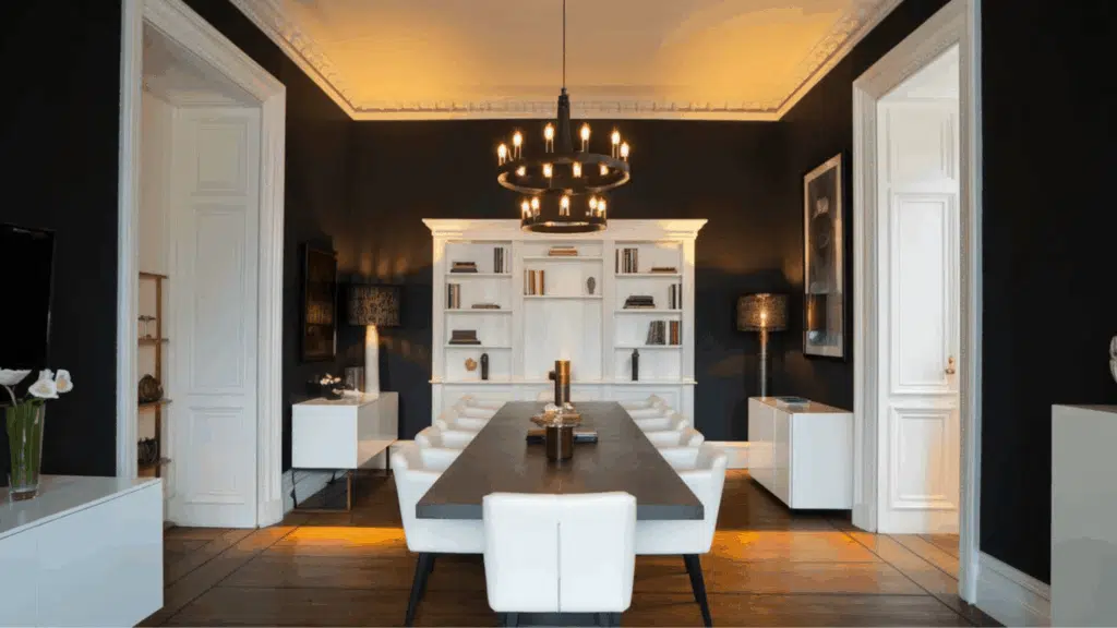 modern dining room with led lighting, warm ambient ceiling lights, dark walls, and minimal furniture setup