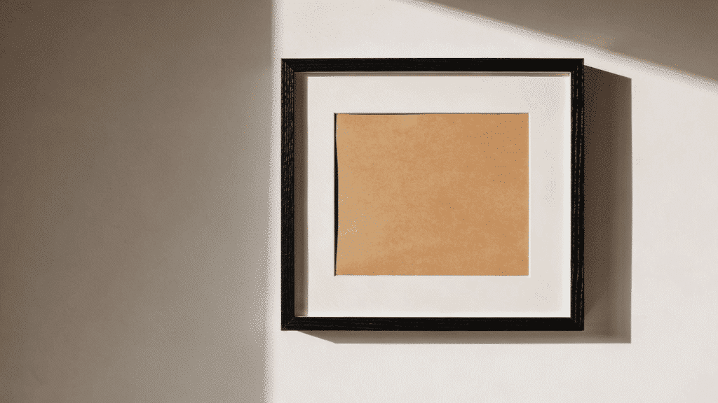 modern diy picture frame with black border and wide mat mounted on white wall