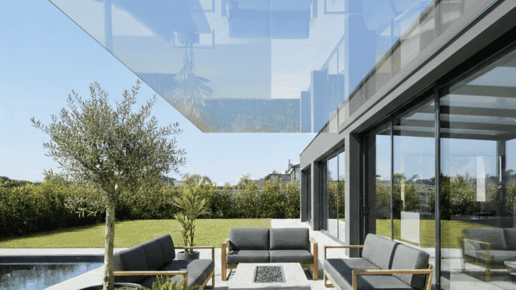 pergola with clear roof panels offering a sleek, modern look while letting in natural light.