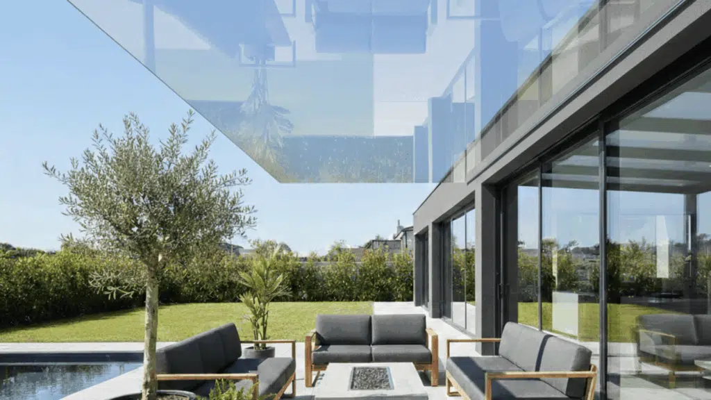 pergola with clear roof panels offering a sleek, modern look while letting in natural light.