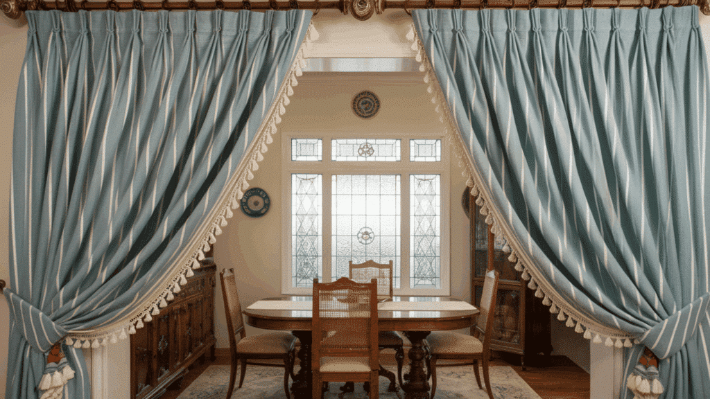 pinch pleat curtains offering a formal and elegant appearance in a dining room.