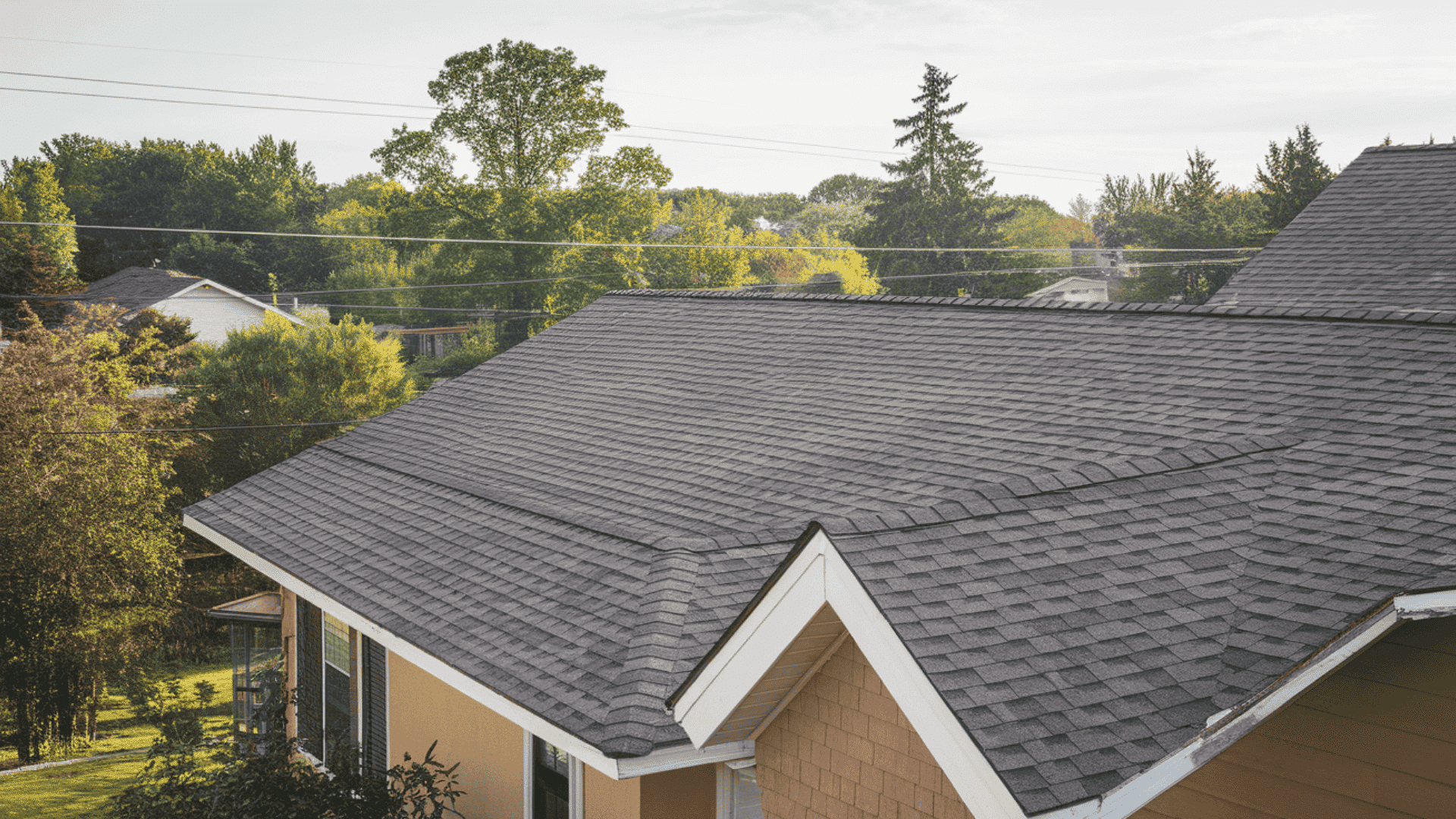 residential home roof showing roof pitch angle with asphalt shingles illustrating common standard roof pitch used in home construction