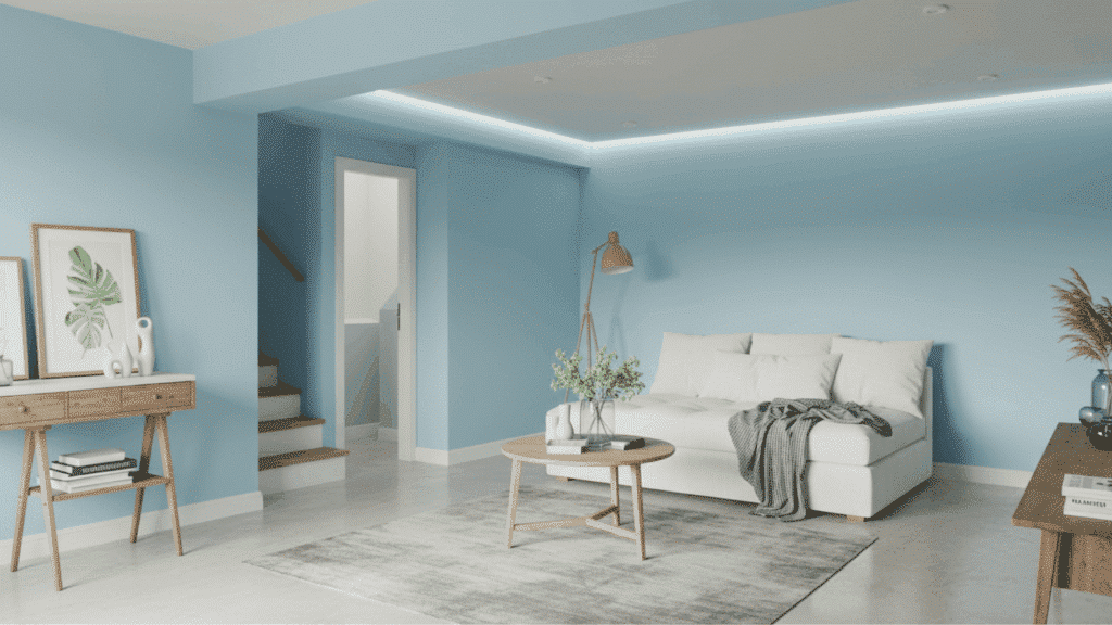 sky blue basement walls with white trim, cozy seating area, wood accents, and soft lighting for a fresh airy feel