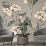 two gray armchairs with a small round table and plant set against a soft floral wallpaper background in a cozy room