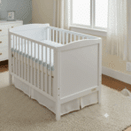 white crib with mattress showing dimensions 52 inches long by 28 inches wide. (1)