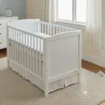 white crib with mattress showing dimensions 52 inches long by 28 inches wide. (1)