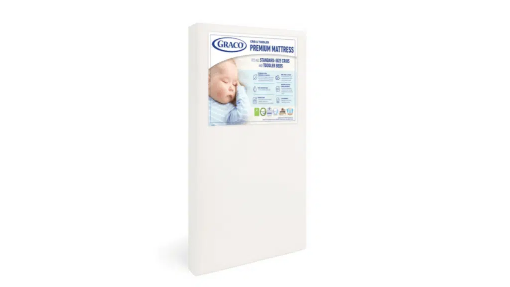white rectangular crib mattress on light green background with measurement labels showing 52 inches length and 28 inches width