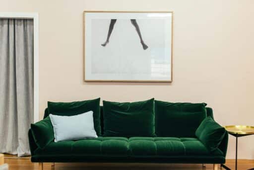 Apartment with a stylish couch and creative decorative elements.