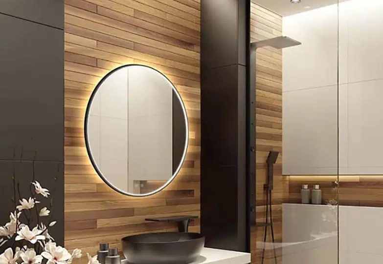 Modern bathroom with a backlit smart circular mirror.