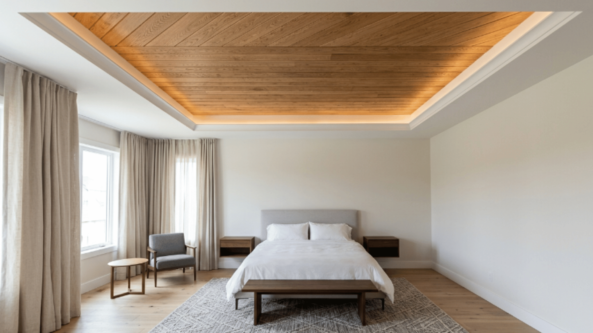 a modern interior with a tray ceiling lined with natural wood planks adding warmth and texture to the space