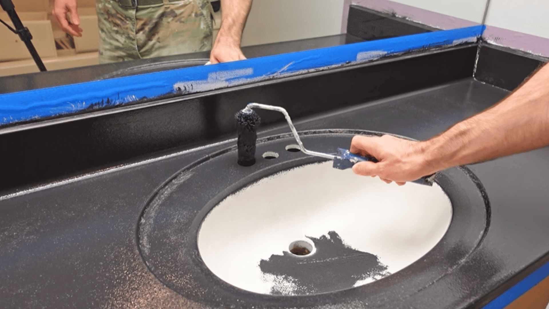 apply black paint in thin coats to create base layer for epoxy finish