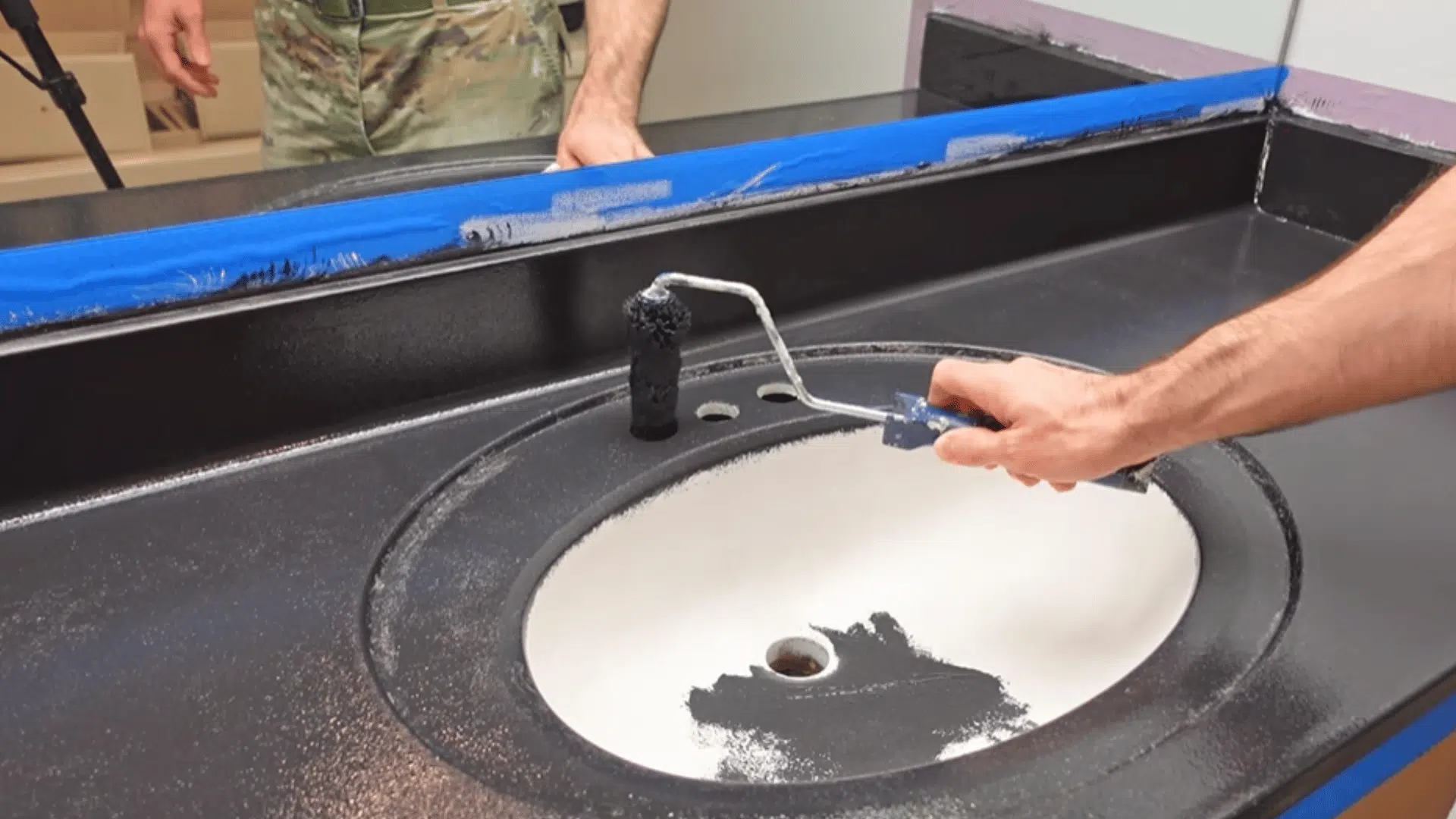 apply black paint in thin coats to create base layer for epoxy finish