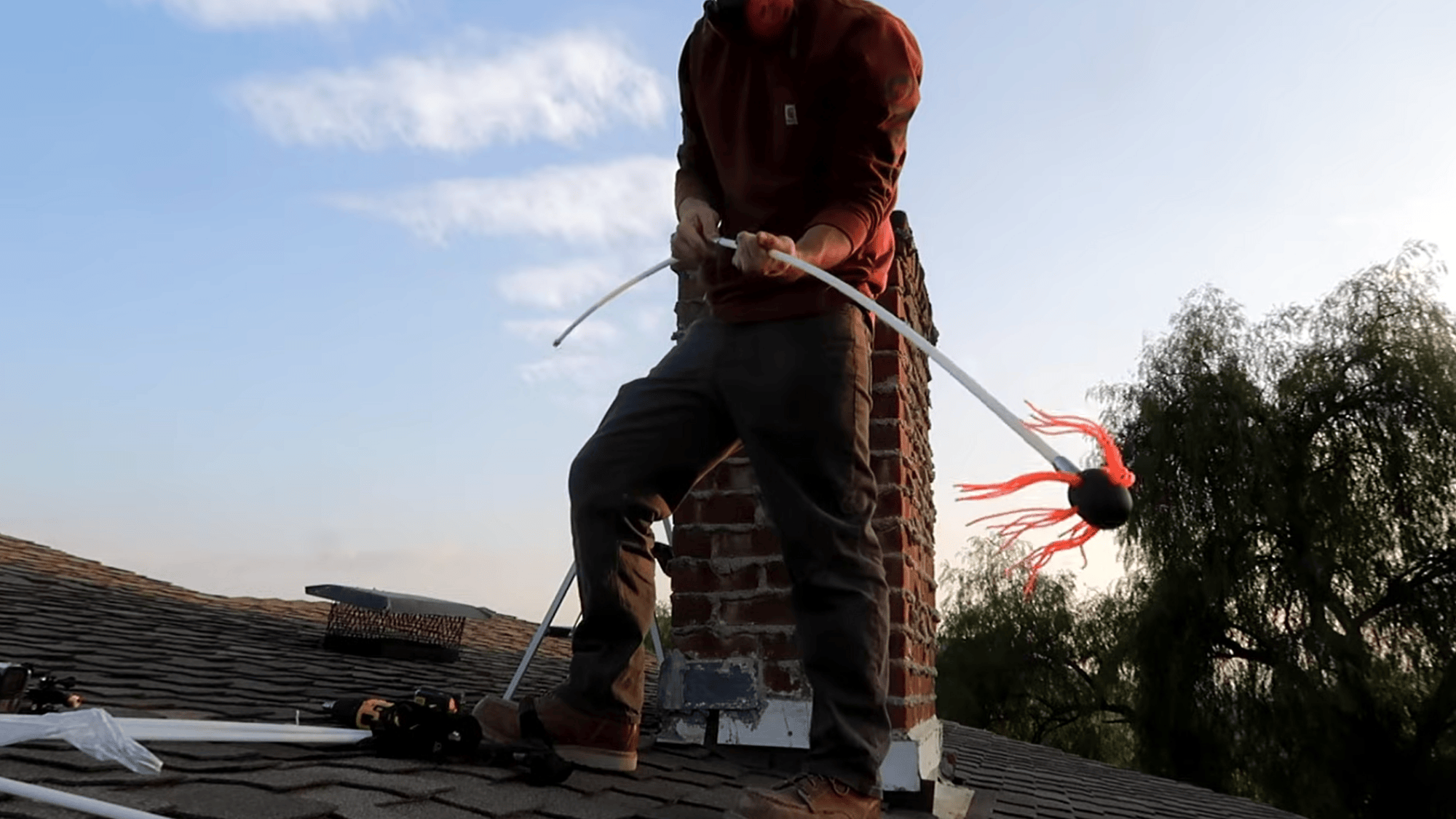 assemble chimney brush and insert into flue for cleaning