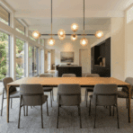 beautiful dining room with stylish lighting fixture above empty table warm soft lighting modern clean interior