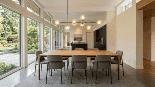 beautiful dining room with stylish lighting fixture above empty table warm soft lighting modern clean interior