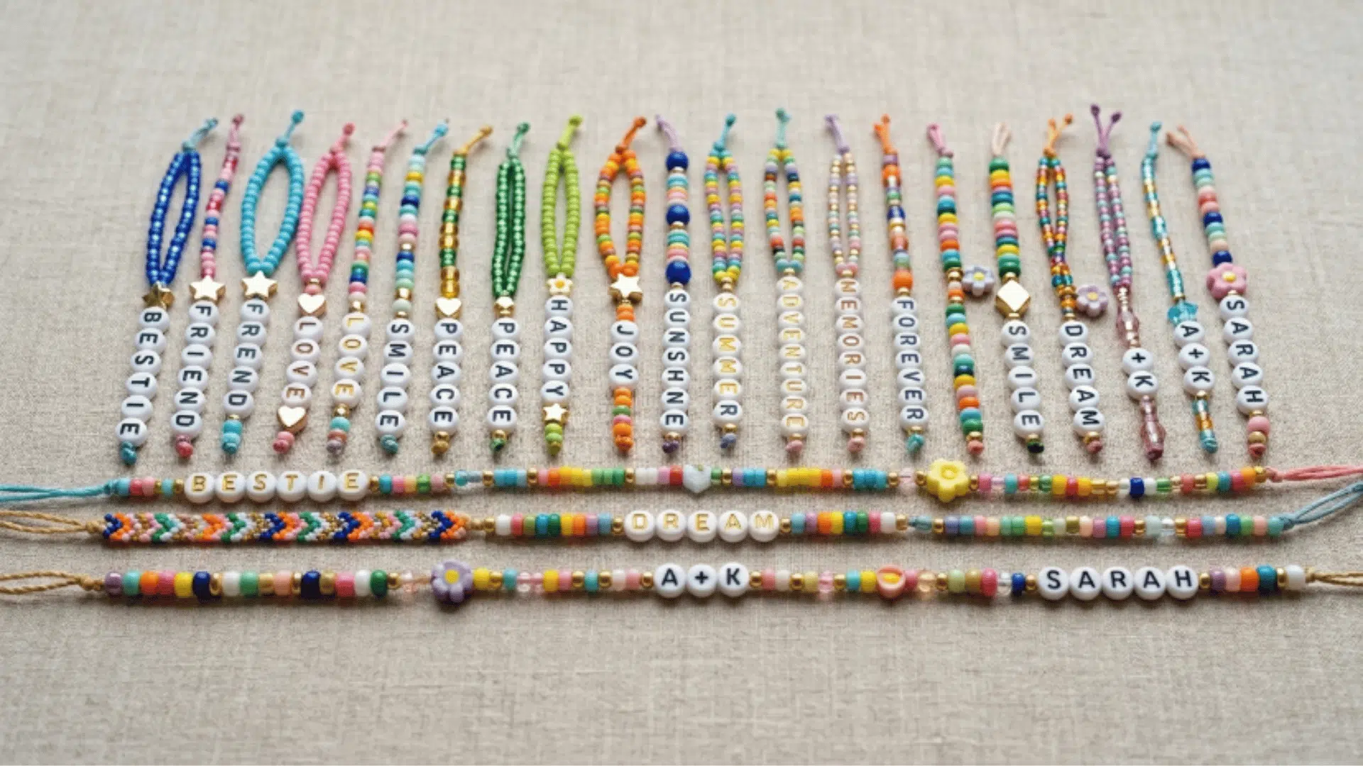 colorful beaded bracelets arranged in patterns on neutral surface showing texture and simple handmade design